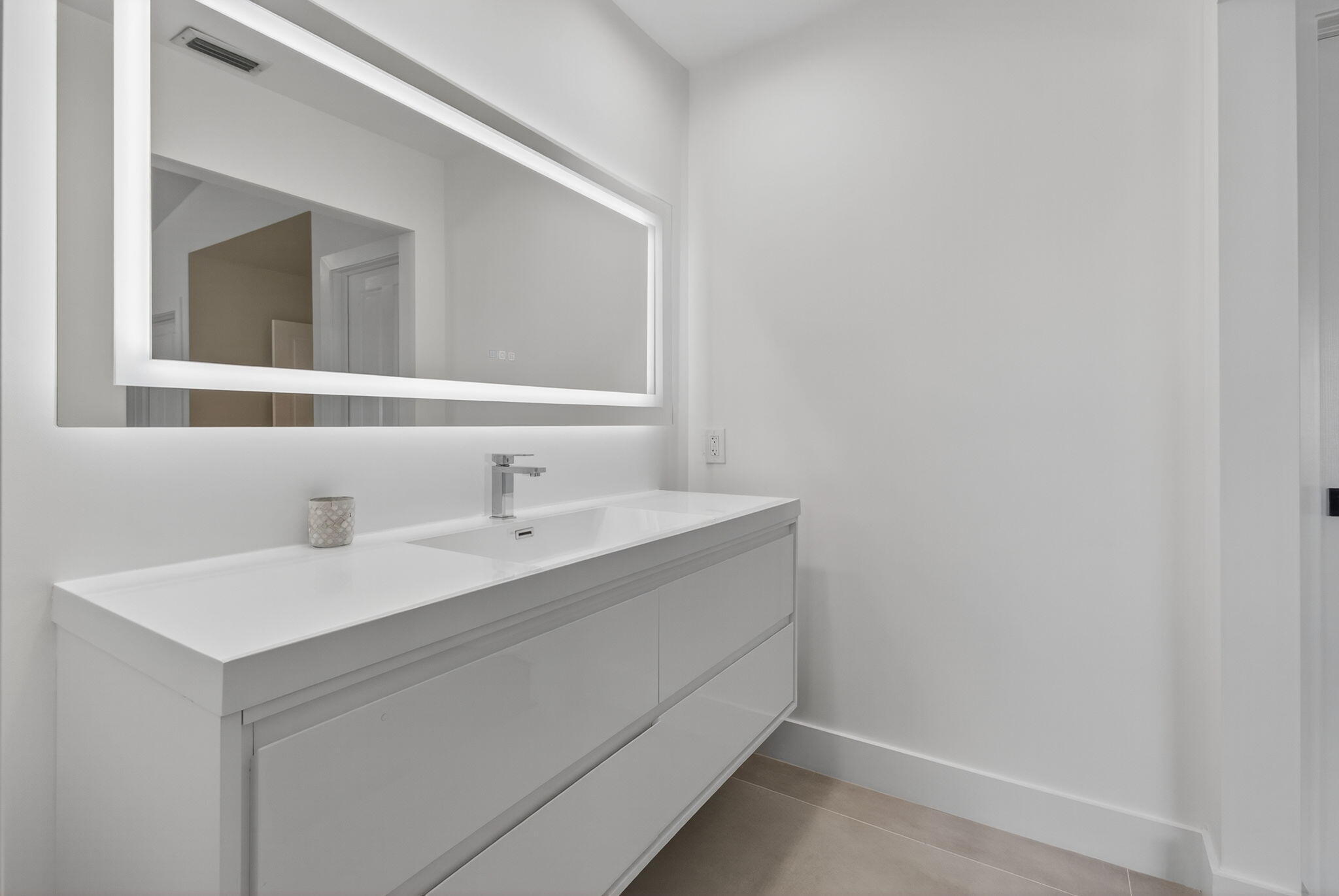 2621 Northwest 53rd Drive Boca Raton, FL 33496 - Photo 30 of 52 a bathroom with a sink and a mirror