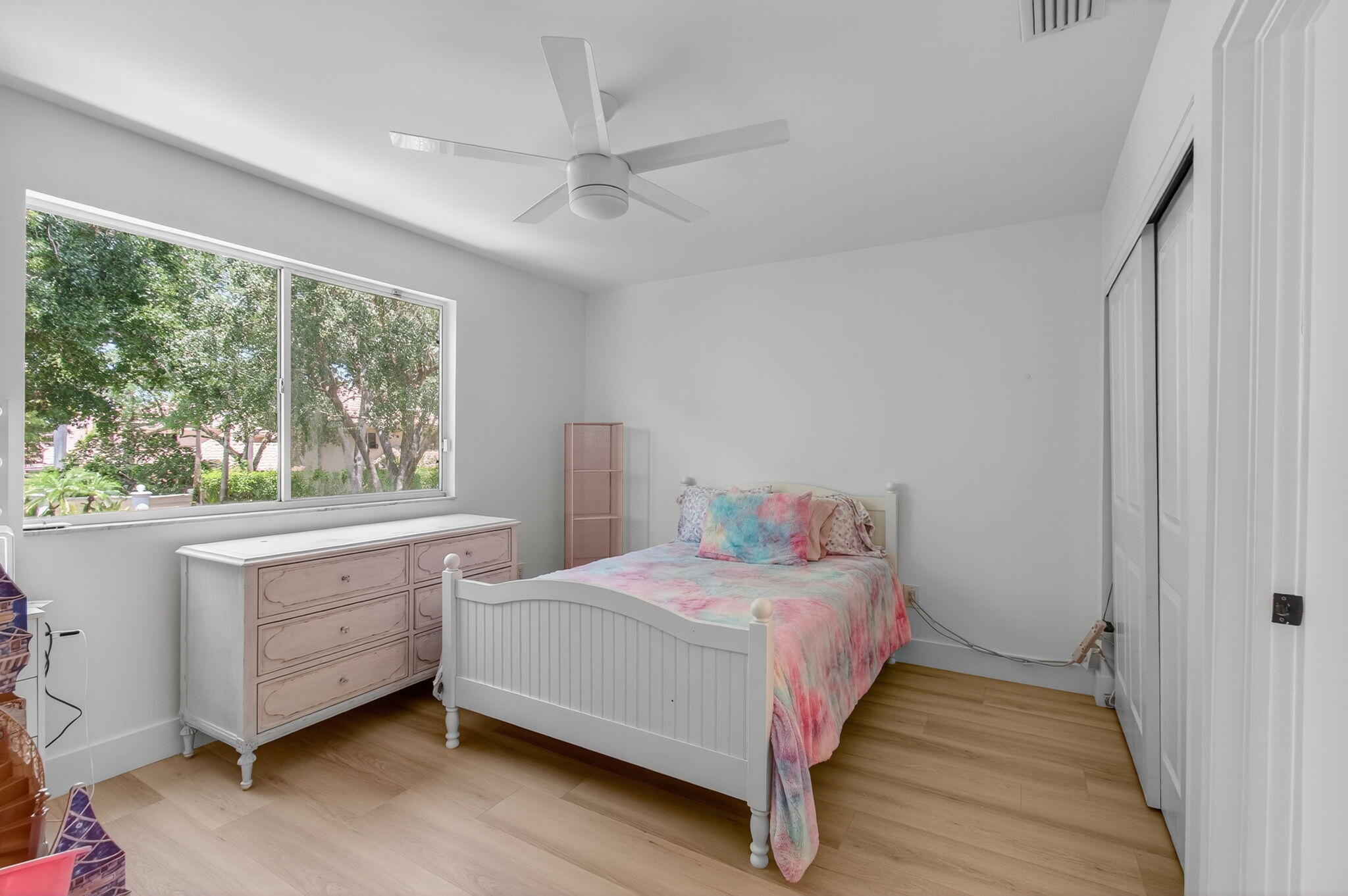 2621 Northwest 53rd Drive Boca Raton, FL 33496 - Photo 31 of 52 a bedroom with a bed and a large window