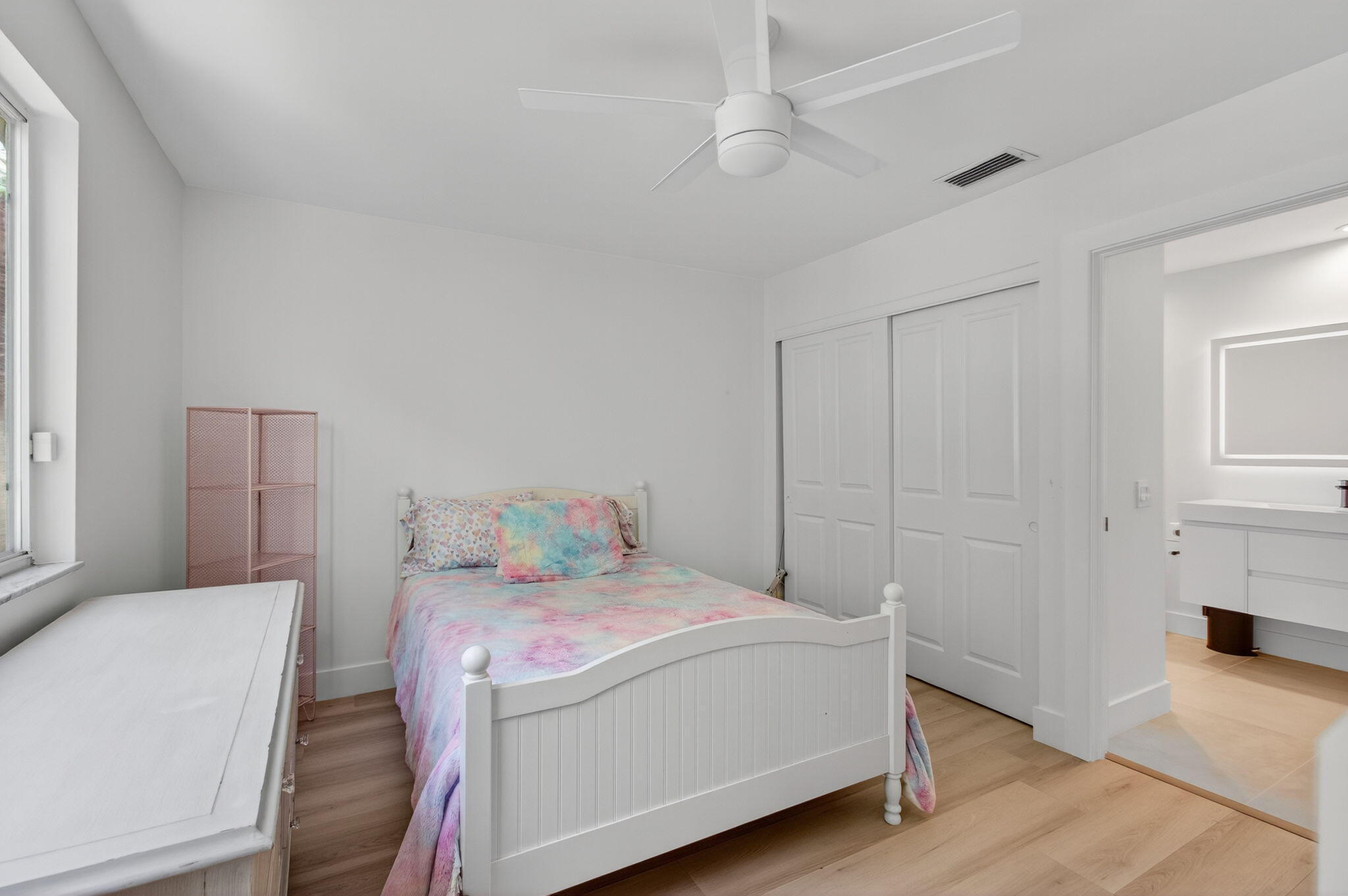 2621 Northwest 53rd Drive Boca Raton, FL 33496 - Photo 32 of 52 a bedroom with a bed and a couch