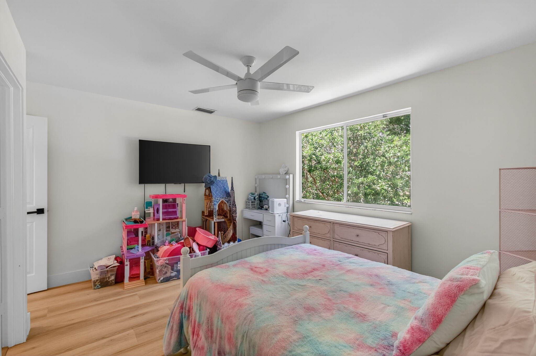 2621 Northwest 53rd Drive Boca Raton, FL 33496 - Photo 33 of 52 a bedroom with a bed and a flat screen tv