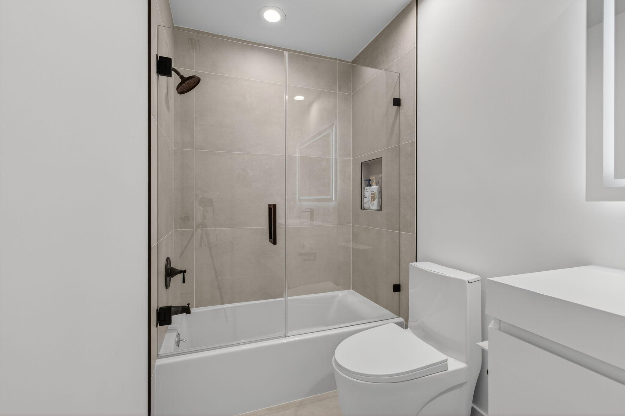 2621 Northwest 53rd Drive Boca Raton, FL 33496 - Photo 35 of 52 a bathroom with a toilet sink and shower