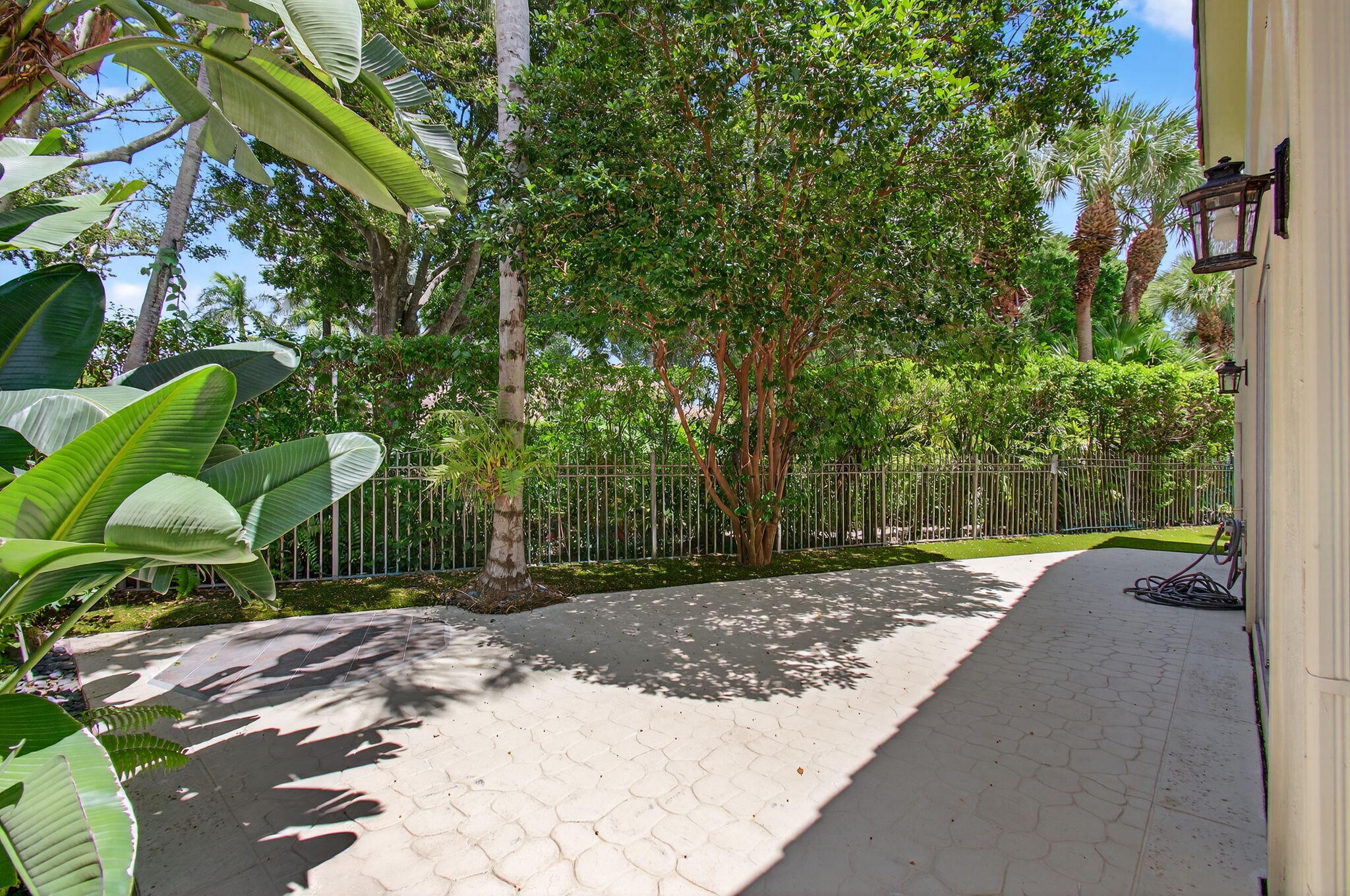 2621 Northwest 53rd Drive Boca Raton, FL 33496 - Photo 38 of 52 a backyard of a house with lots of trees