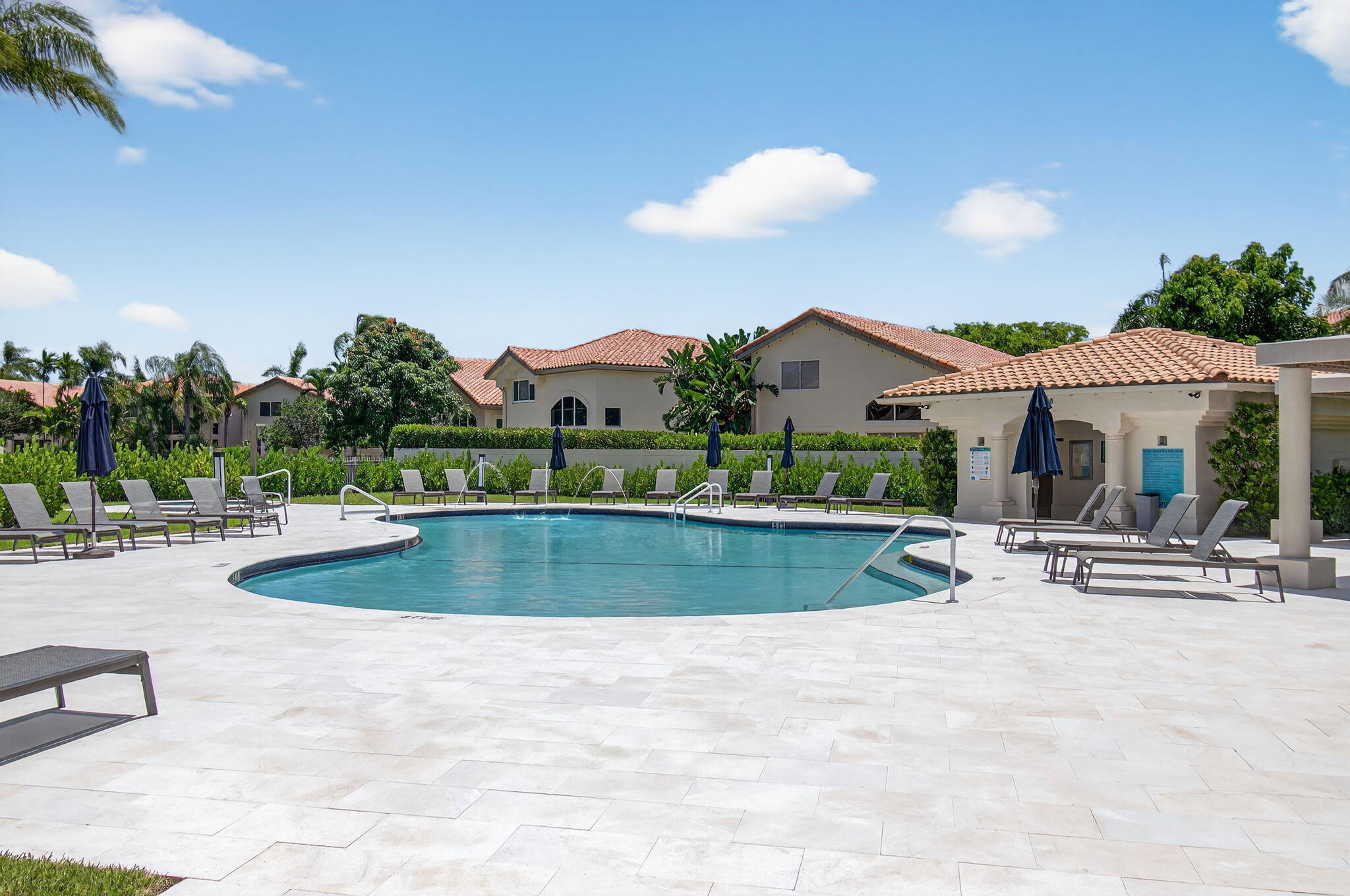 2621 Northwest 53rd Drive Boca Raton, FL 33496 - Photo 43 of 52 a view of a house with swimming pool and sitting area