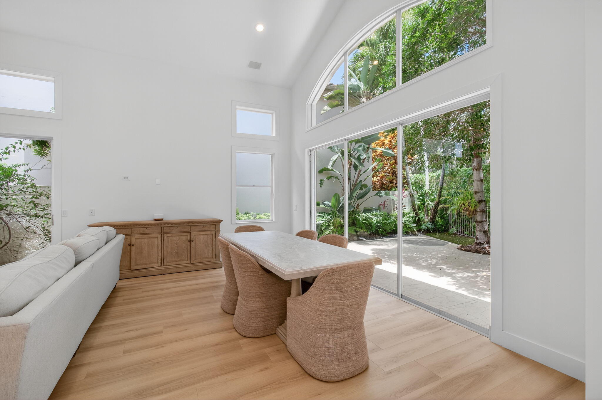 2621 Northwest 53rd Drive Boca Raton, FL 33496 - Photo 7 of 52 a living room with furniture and a large window