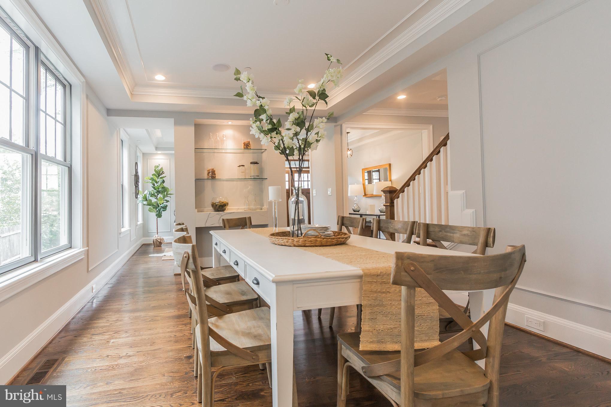 736 Thayer Avenue Silver Spring, MD 20910 - Photo 15 of 30 a view of a dining room with furniture and a chandelier