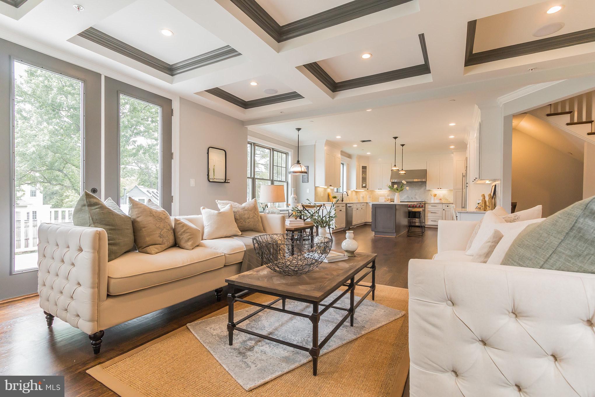 736 Thayer Avenue Silver Spring, MD 20910 - Photo 18 of 30 a living room with furniture wooden floor and a large window