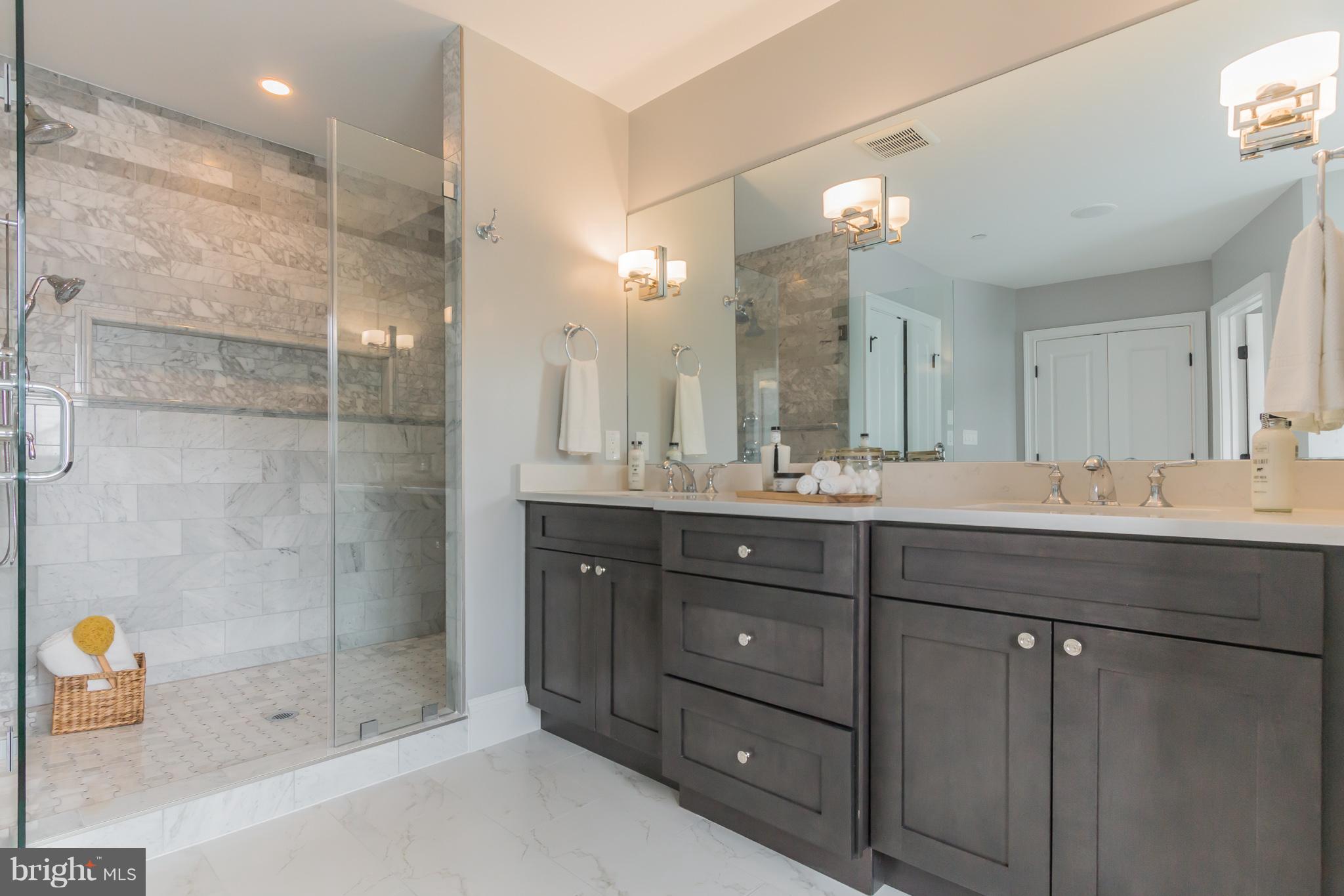 736 Thayer Avenue Silver Spring, MD 20910 - Photo 24 of 30 a bathroom with a sink shower and a mirror