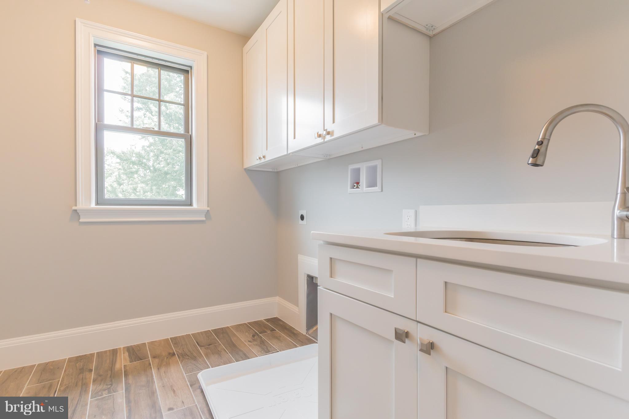 736 Thayer Avenue Silver Spring, MD 20910 - Photo 25 of 30 a bathroom with a sink and cabinets