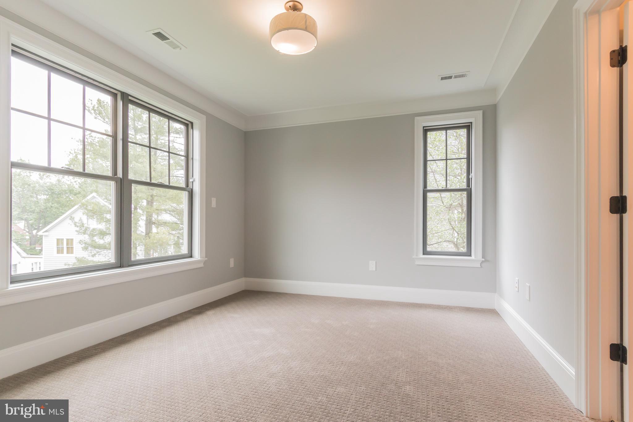 736 Thayer Avenue Silver Spring, MD 20910 - Photo 26 of 30 an empty room with windows and closet