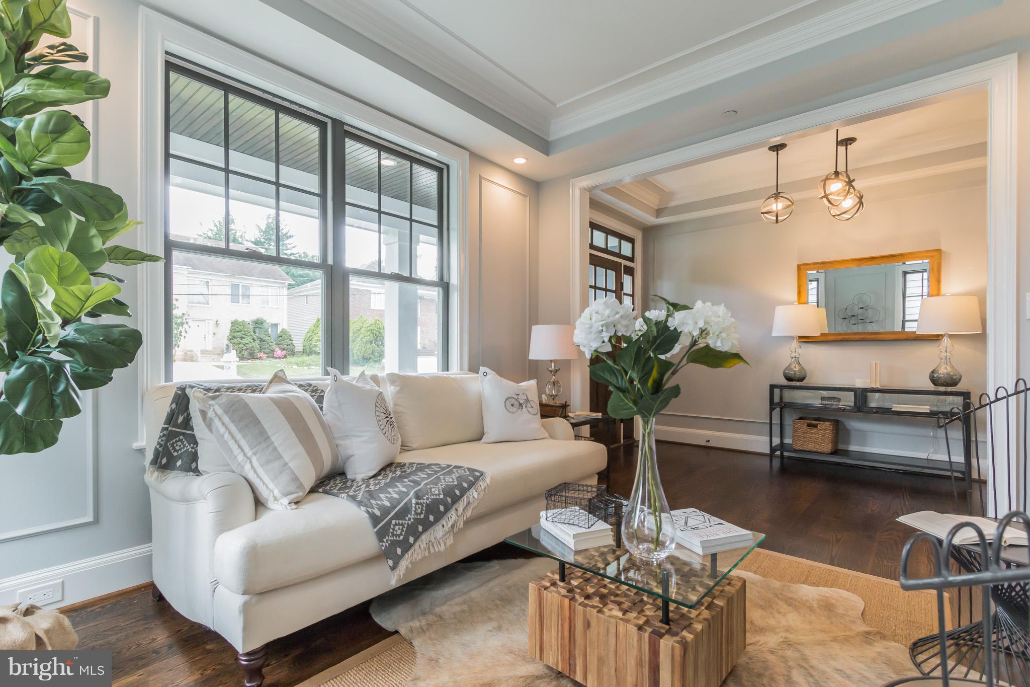 736 Thayer Avenue Silver Spring, MD 20910 - Photo 6 of 30 a living room with furniture and a large window