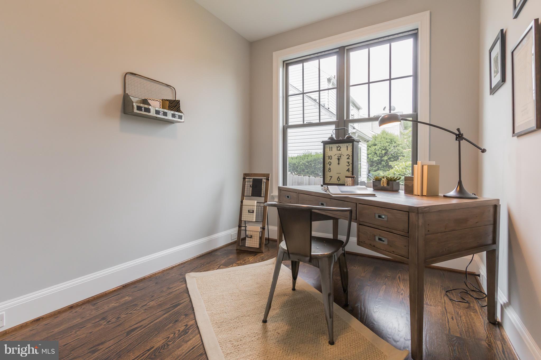 736 Thayer Avenue Silver Spring, MD 20910 - Photo 9 of 30 a workspace with wooden floor and a window