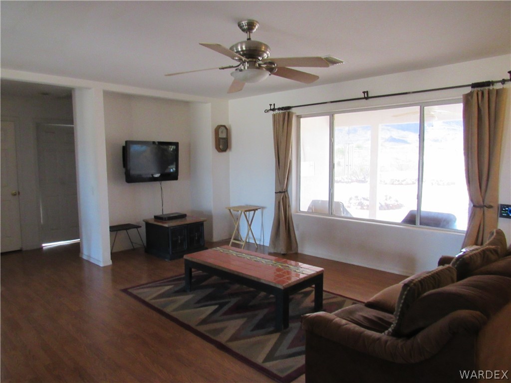 2002 Drake Road Golden Valley, AZ 86413 - Photo 6 of 50 a living room with furniture and a flat screen tv