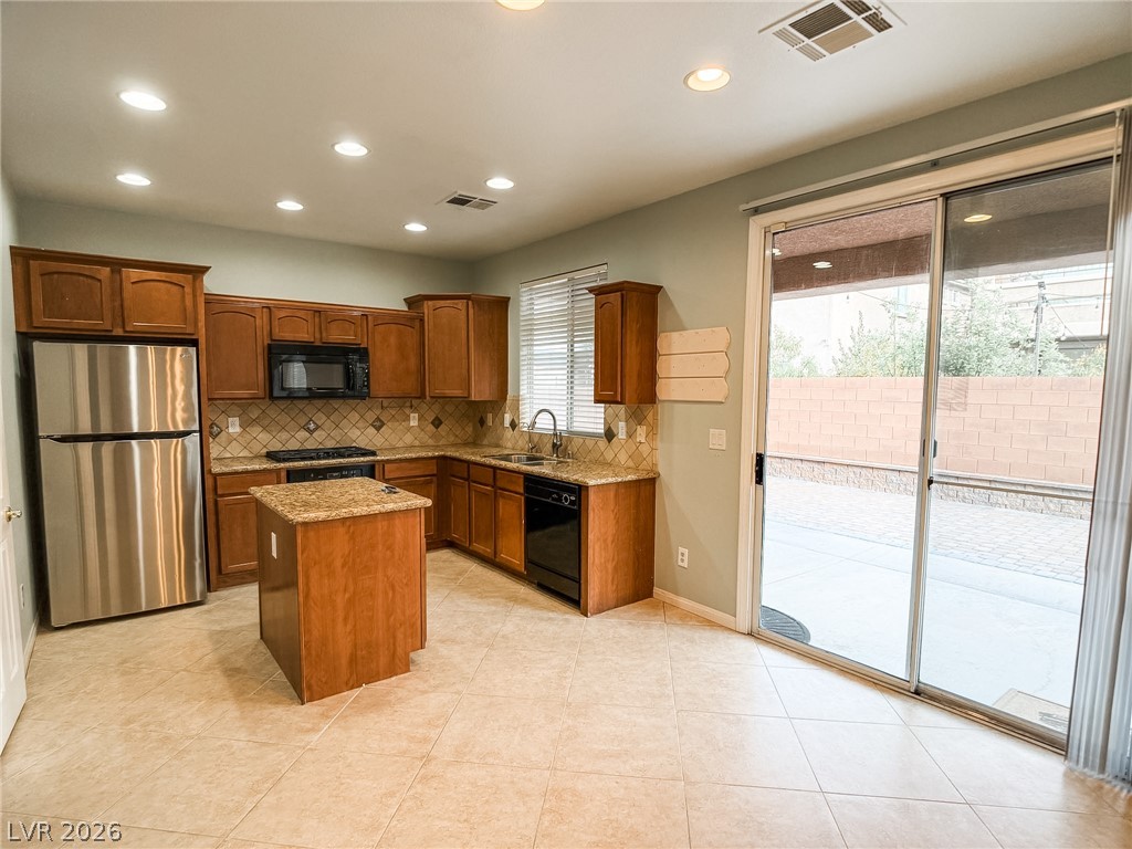 8683 Moreno Mountain Avenue Las Vegas, NV 89178 - Photo 6 of 26 Culinary aspirations come alive in this kitchen, boasting modern appliances and direct access to outdoor living.