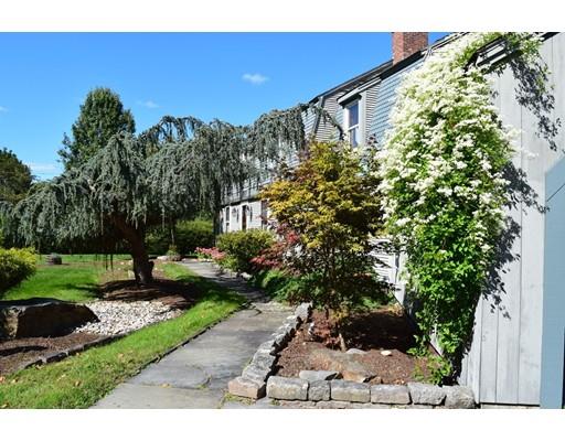27 Sampson Road Bolton, MA 01740 - Photo 2 of 42 a front view of a house with a yard