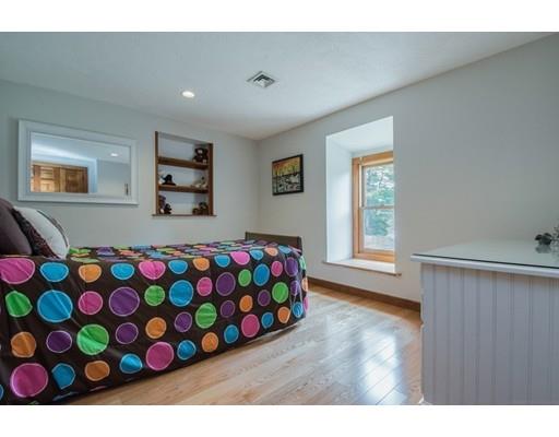27 Sampson Road Bolton, MA 01740 - Photo 27 of 42 a bedroom with a bed and a dresser