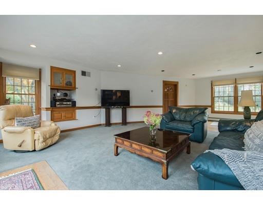 27 Sampson Road Bolton, MA 01740 - Photo 5 of 42 a living room with furniture and a couch