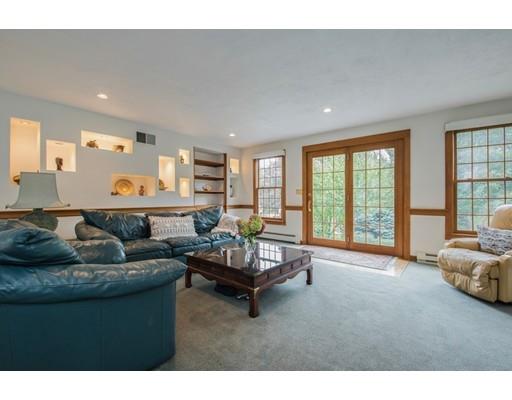 27 Sampson Road Bolton, MA 01740 - Photo 6 of 42 a living room with furniture and a large window
