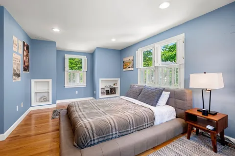 a bedroom with a bed and a lamp