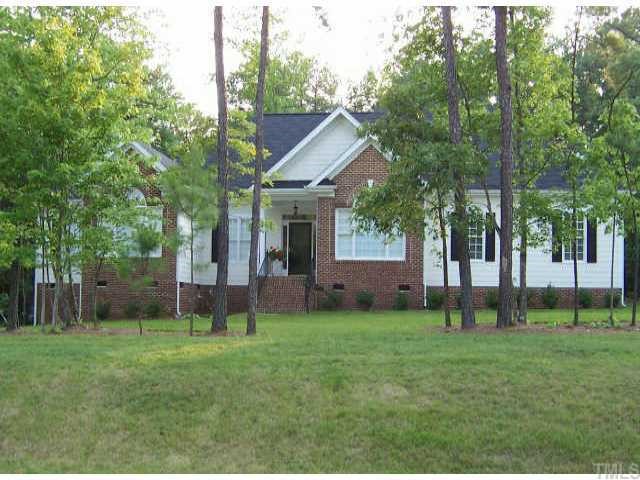5253 Bartons Enclave Lane Raleigh, NC 27613 - Photo 1 of 1 a view of a house with a yard and sitting area