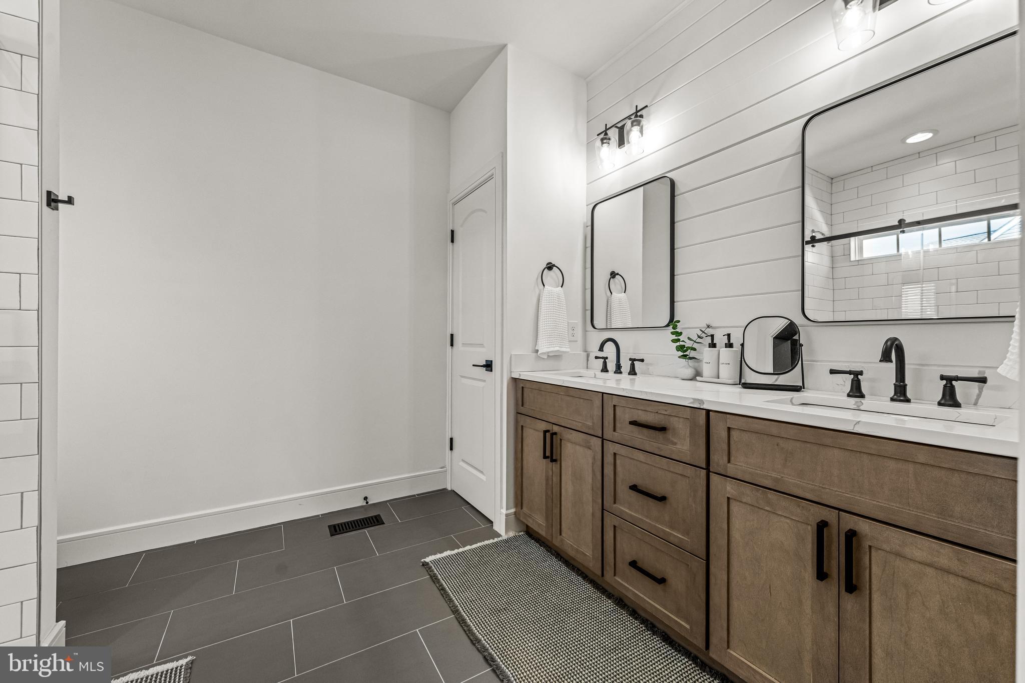 641 A Fordville Road Bridgeton, NJ 08302 - Photo 22 of 34 a spacious bathroom with a double vanity sink a mirror and with