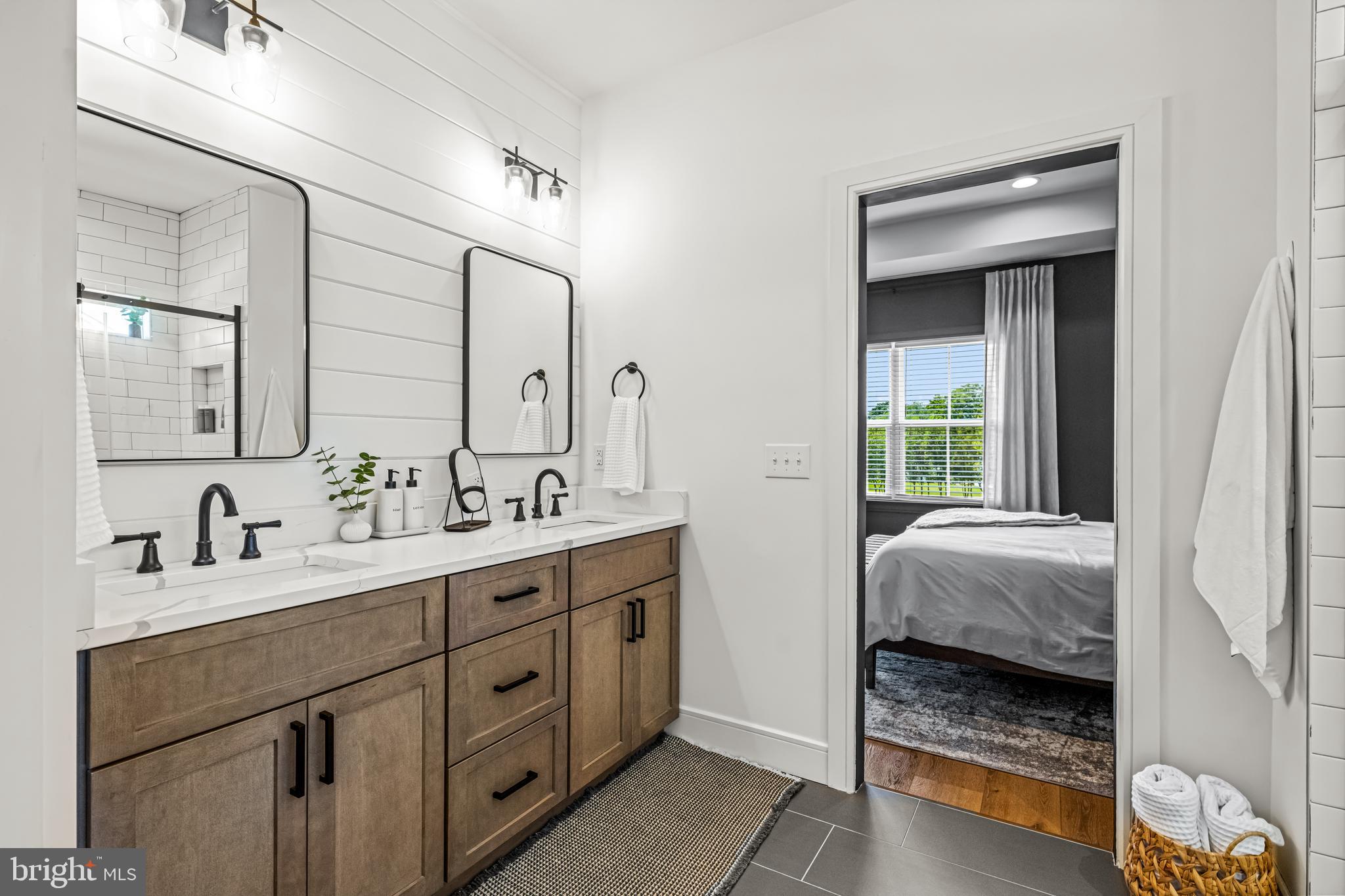 641 A Fordville Road Bridgeton, NJ 08302 - Photo 23 of 34 a en suite bathroom with a double vanity sink and mirror