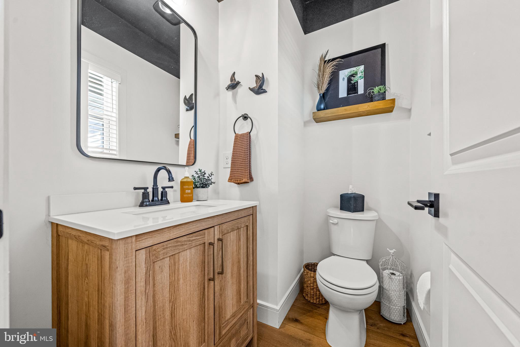 641 A Fordville Road Bridgeton, NJ 08302 - Photo 9 of 34 a bathroom with a toilet a sink and mirror