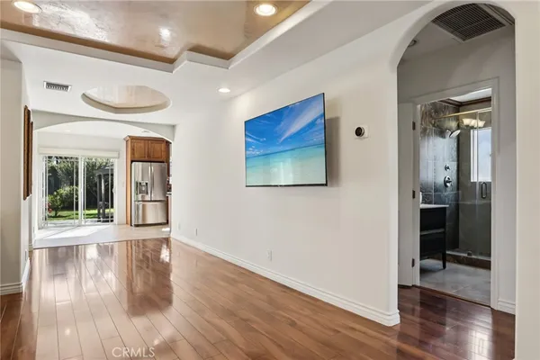 a kitchen with stainless steel appliances granite countertop a refrigerator and a sink