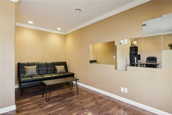 a large bed sitting in a bedroom next to a window