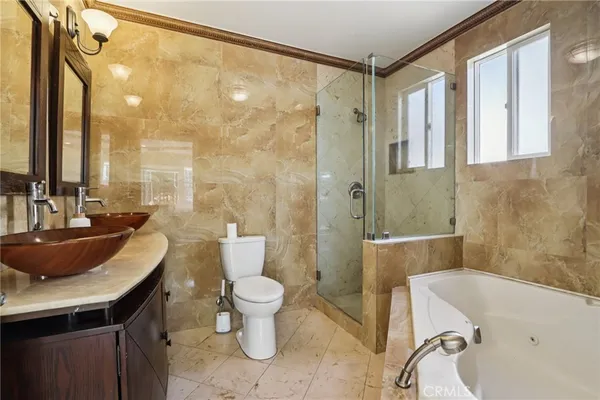 a backyard of a house with fountain and barbeque oven