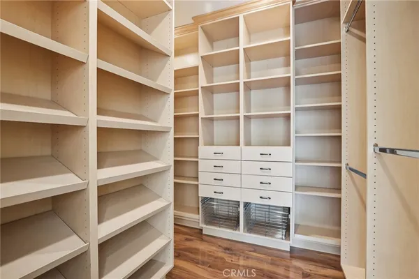 a view of street with flower on wooden wall