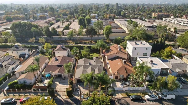 an aerial view of a house with a yard