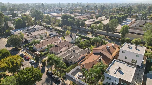 an aerial view of residential houses with outdoor space