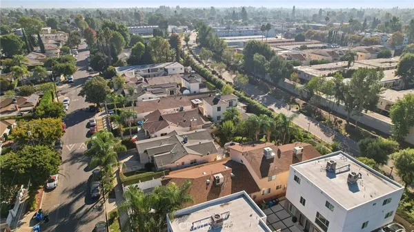 an aerial view of residential houses with outdoor space