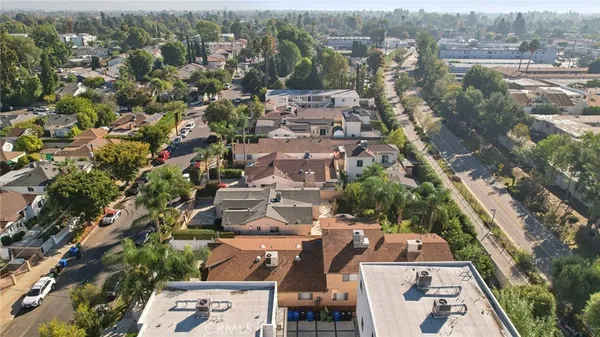 an aerial view of residential houses with outdoor space