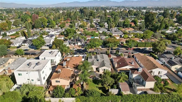 an aerial view of residential houses with outdoor space