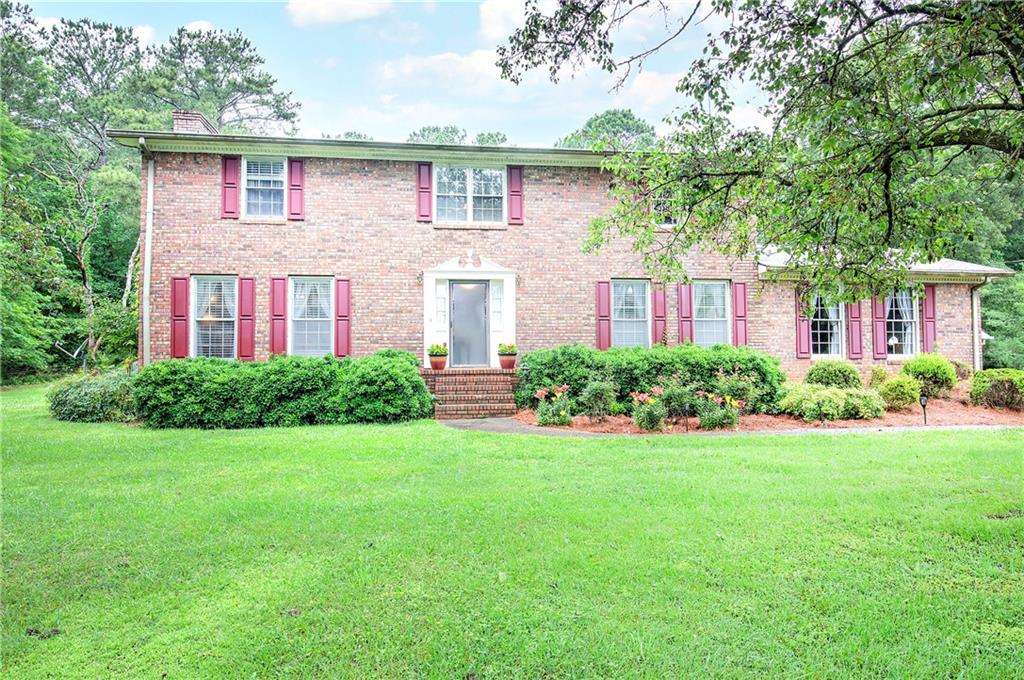 3637 Nebo Road Hiram, GA 30141 - Photo 1 of 63 a front view of a house with garden