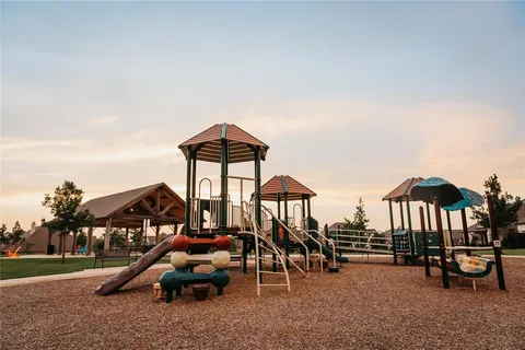 a view of a park with large trees