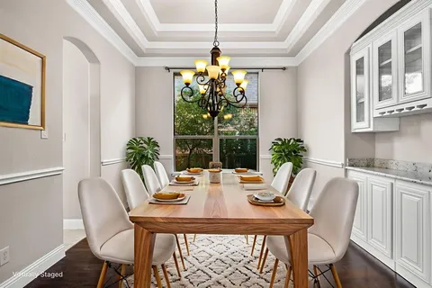 a view of a kitchen with a window and wooden floor