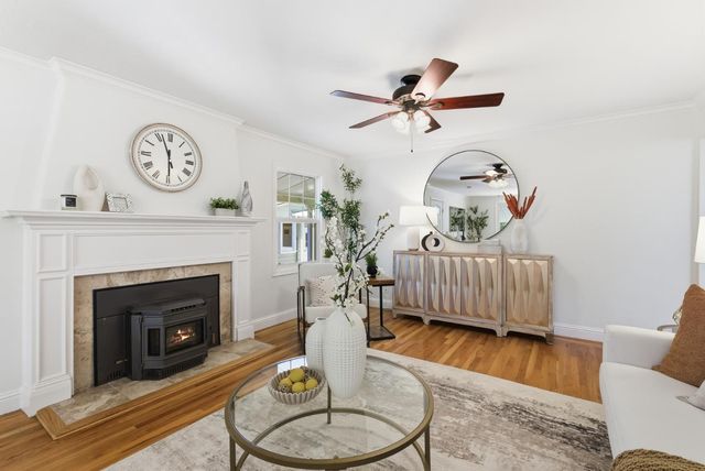 a kitchen with granite countertop a stove top oven microwave and cabinets