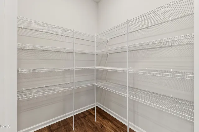 an empty room with wooden floor