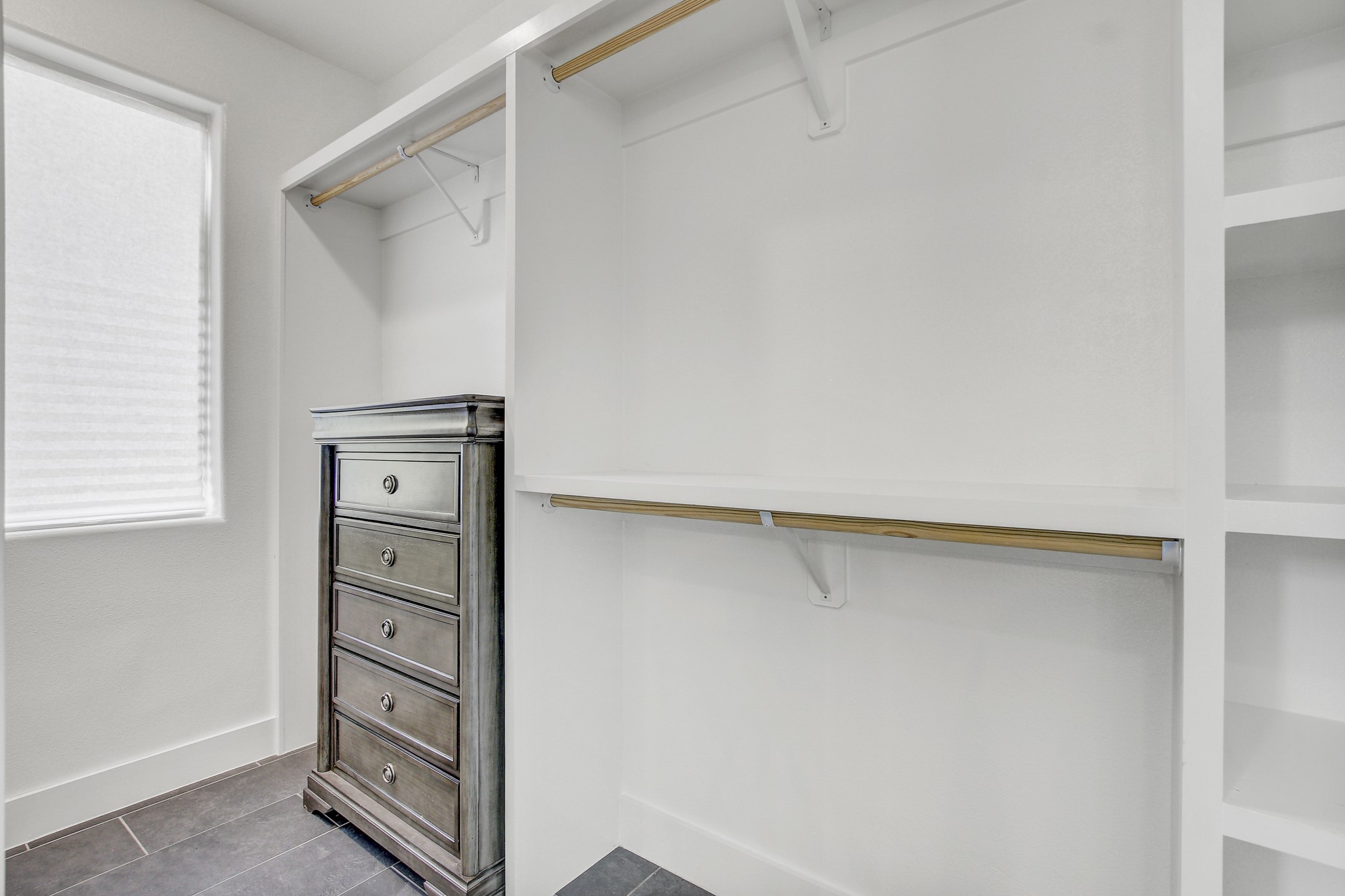 4703 Louis Avenue, Unit A Austin, TX 78721 - Photo 24 of 35 Walk in closet featuring dark tile patterned floors