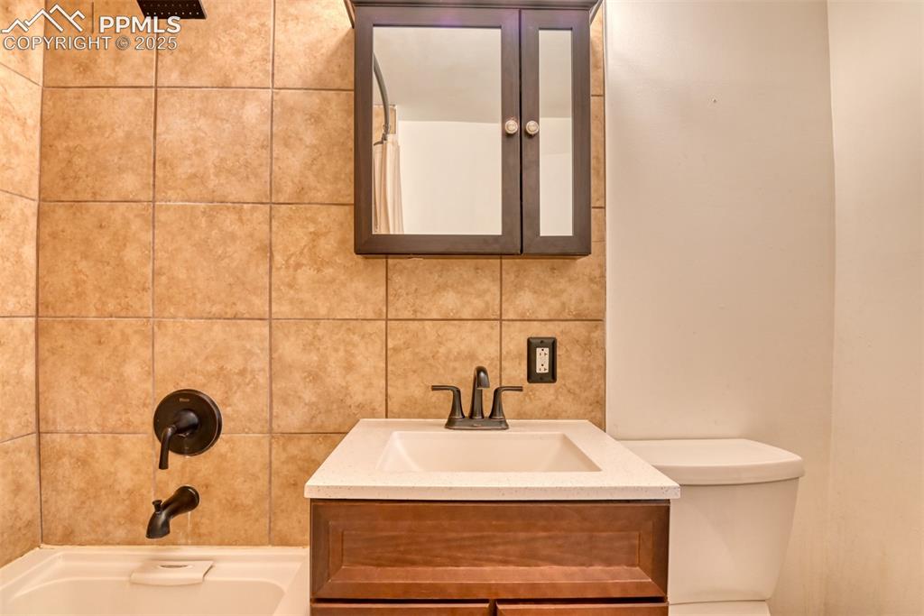 10970 Garrett Road Peyton, CO 80831 - Photo 19 of 50 a bathroom with a sink and a window
