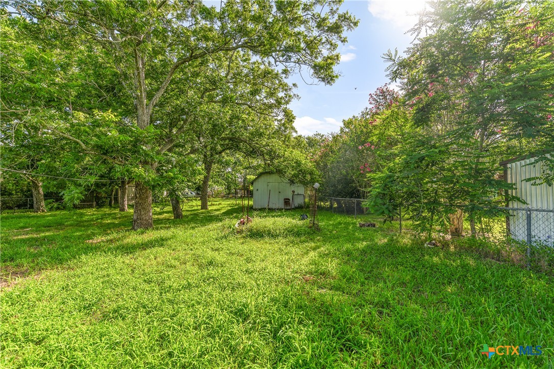 401 Kerr Street Edna, TX 77957 - Photo 19 of 23 a view of backyard with green space