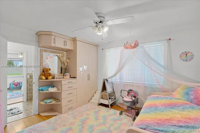 a room with furniture and fan