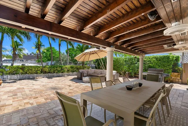 a view of outdoor space with table and chairs