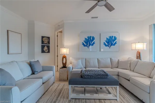 a living room with furniture a rug and a couch