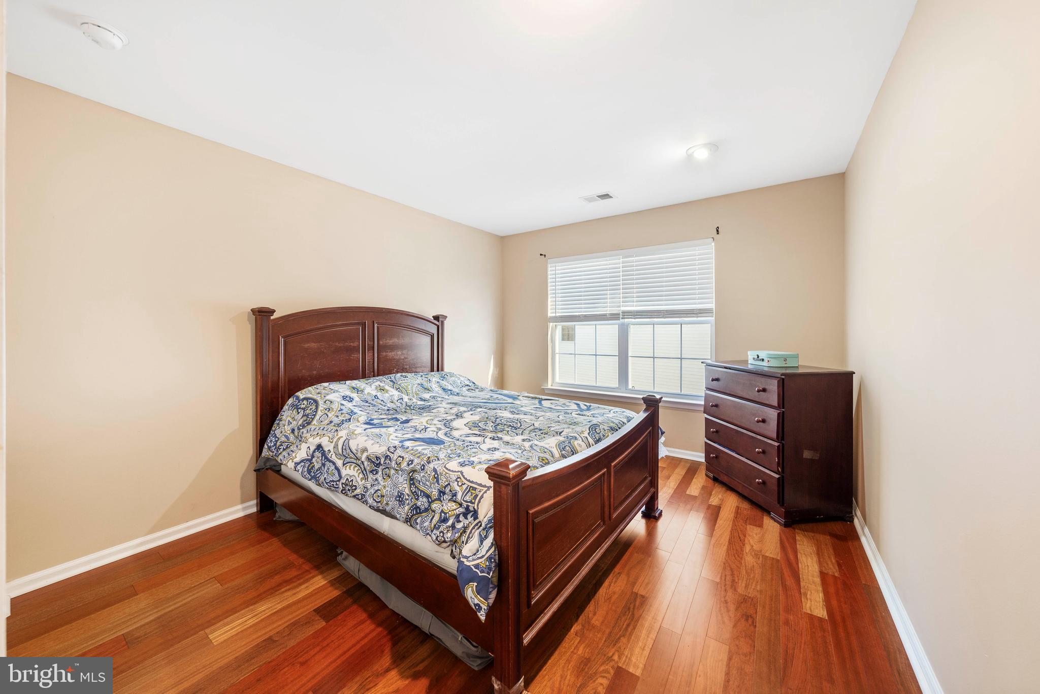 33 Cayuga Road Bordentown, NJ 08505 - Photo 14 of 30 a bedroom with a bed and wooden floor