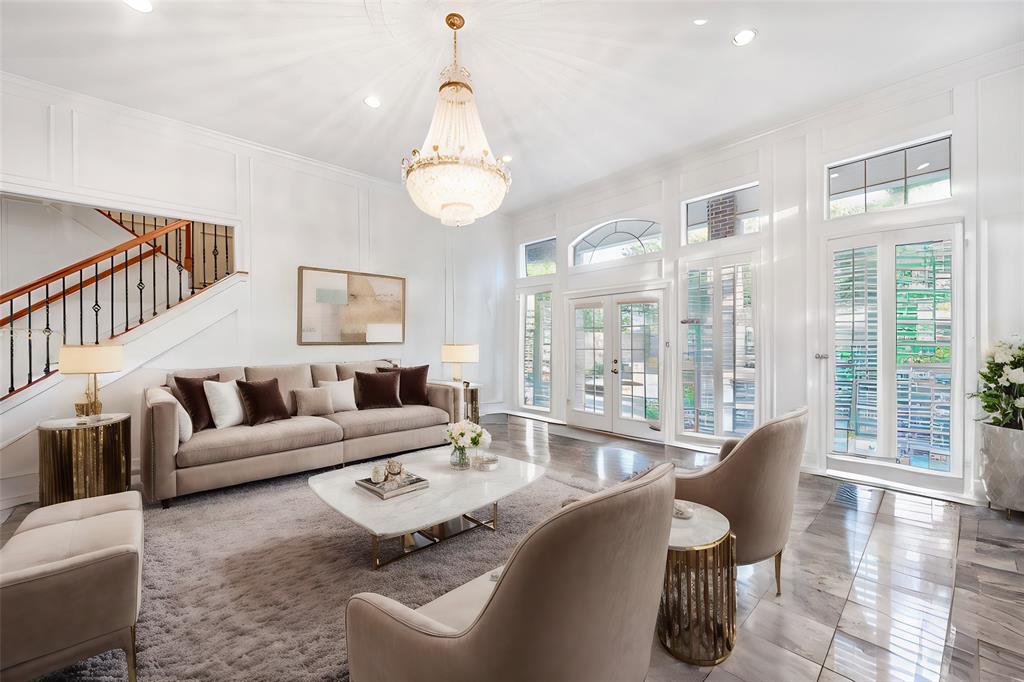7204 Debbe Drive Dallas, TX 75252 - Photo 11 of 39 a living room with furniture chandelier and a large window