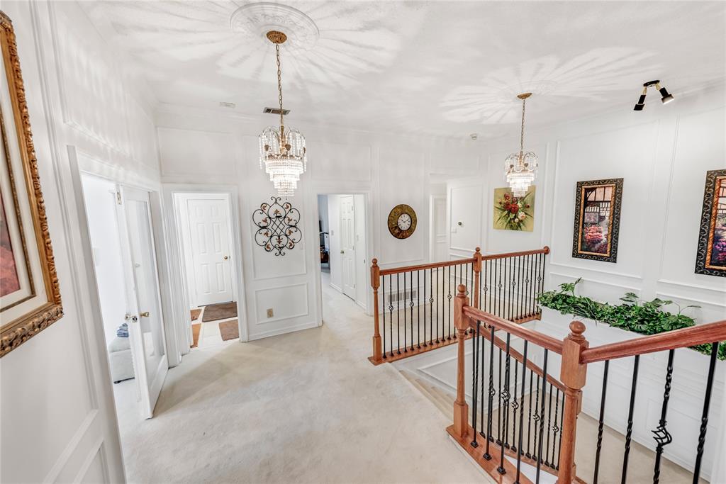 7204 Debbe Drive Dallas, TX 75252 - Photo 23 of 39 a view of a hallway view with windows