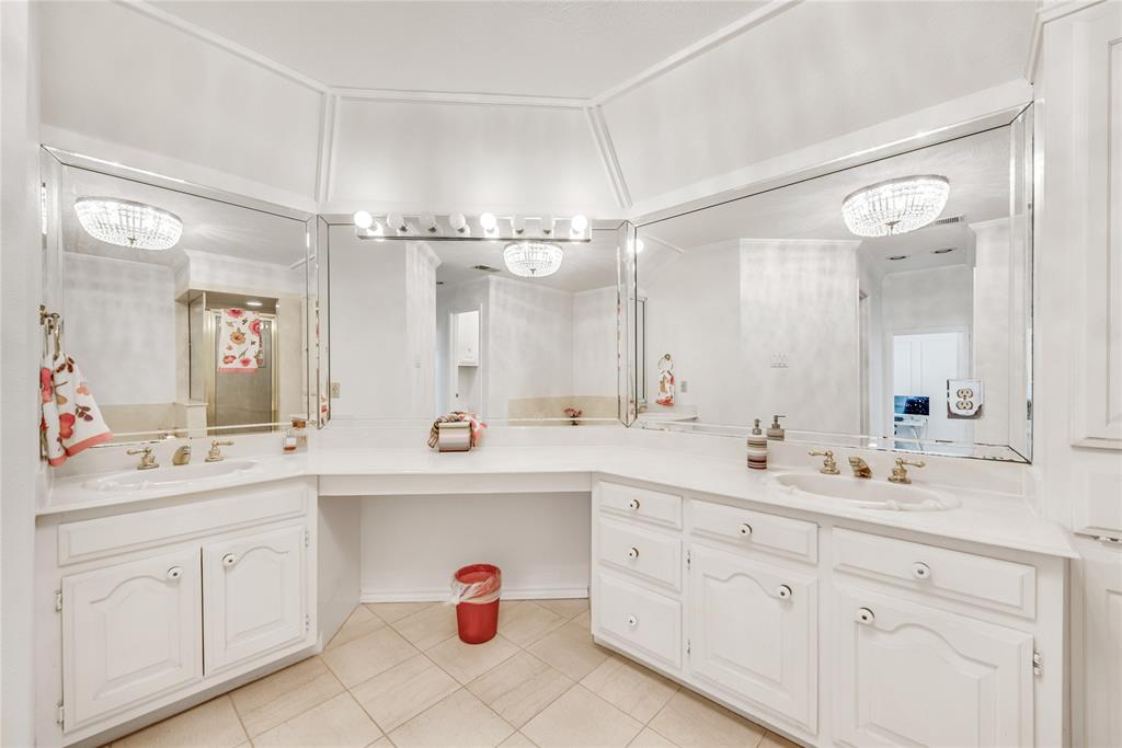 7204 Debbe Drive Dallas, TX 75252 - Photo 30 of 39 a spacious bathroom with a double vanity sink mirror and